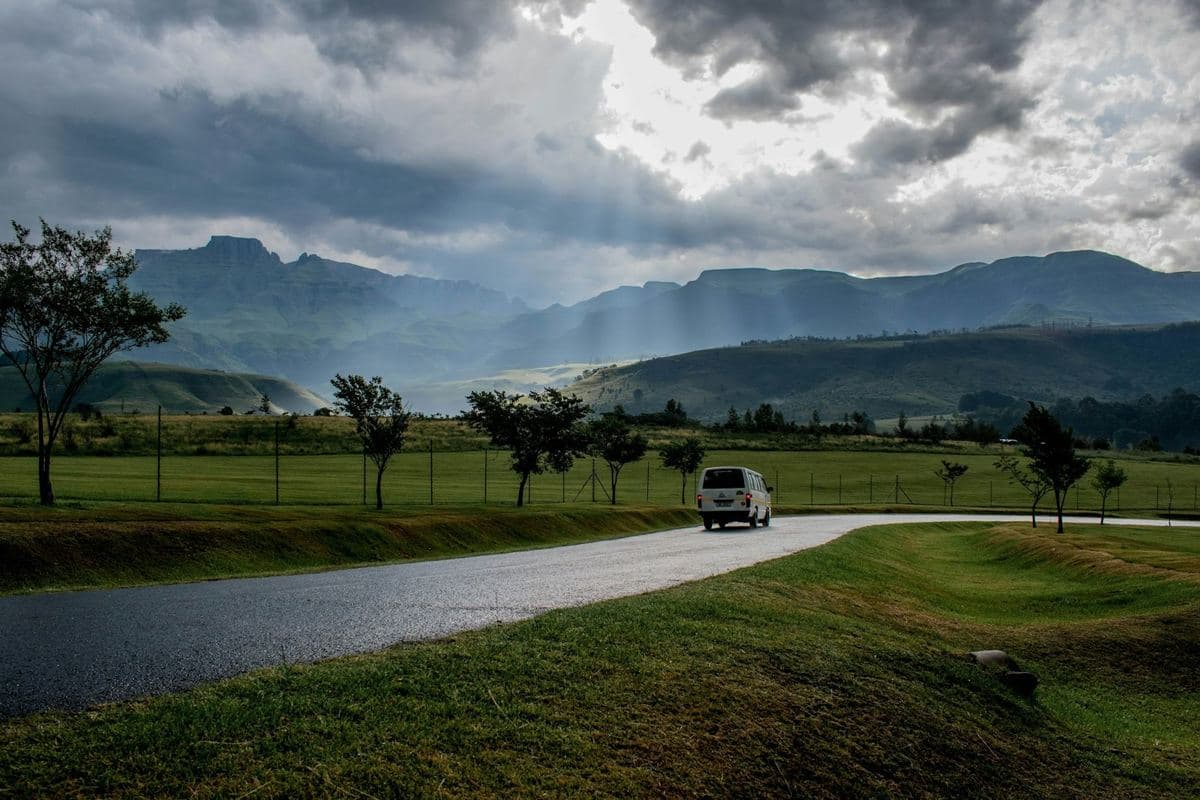 White passenger shuttle van on a road — Costa Rica private transfer